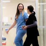 Women: (L to R) Madison Maley, CNA and Tracy Dale, RN walk the JRMC emergency department.