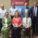 Regents Level Donors: Seated, from left: Patty Klein, Megan Zarbano representing Handy Hardware; Kristine Anderson. Standing, from left: Jeff Nathan, Foundation Board Chair; Dan Klein representing Valley City Kiwanis Club; Cory Anderson; President Alan LaFave.