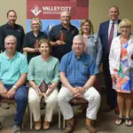 Gold Level Donors: Seated, from left: Brian Ringdahl, Kathy Marquette and Steve Ringdahl representing Gerald and Judy Ringdahl. Standing, from left: Jeff Nathan, Foundation Board Chair; Tony Lam and Lisa Rush representing Leevers Foods; Wade and Kim Hesch; President Alan LaFave; Carole and Mark Richman.