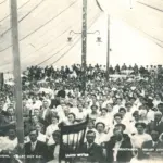Chautauqua: Tent filled with people.