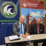 Signing Agreement: L to R: Dr. Matt Borcherding, Provost/Vice President for Academic Affairs at M State (left), and Larry Brooks, Vice President for Academic Affairs at VCSU.
