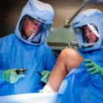 Surgery: Orthopedic surgeon Dr. Michael T. Dean performs a knee replacement procedure, part of the high-quality care recognized by the Blue Distinction® Center designation.