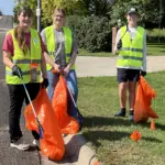 river-clean-up: Staci Dreyer-Larson an instructor at VCSU, Ella Berguist a student at VCSU and Austin Anderson at VCHS all volunteered to walk the Valley City streets and pick up litter.