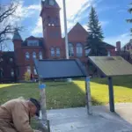 Lewis Legge: Setting up display stands on VCSU campus.