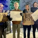Protesters: L-R VCHS Senior Carter Hass, VCHS Sophomore Quin Kruger, VCHS Junior Cole Haugen, Winona State Junior Casey Kruger.