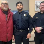 Pinning ceremony: L to R; Georgia Mageo father, Officer Mageo, and Police Chief Nick Horner.