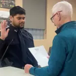 Mayor Dave Carlsrud: Administers the oath of office.