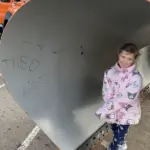 Student signs the plow