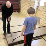 Fr. Paul Duchschere: Showing off his putting skills.