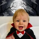 AI generated image: Jerry put his grandson into a vampire costume at Halloween.