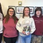 Erin Edinger: Photo: Members of Student Senate present Erin Edinger (center) with her Student Advocate Award.