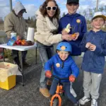 Fruit: Michelle Grebel from Epworth Methodist Church talked about hunger to student walkers, and offered them some fruit to nibble on.