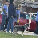 Students with dog: Dogs are pets for kids around the world, and a number of dogs walked with their owners during the CROP WALK for HUNGER on May 6.