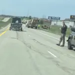 Broken wheel assembly: On left side of the road.