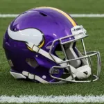 NFL's Minnesota Vikings helmet placed on football field - AI GENERATED IMAGE