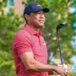 Tiger Woods watches his tee shot off the 10th hole during the final round of the PNC Championship at the Ritz-Carlton Golf Club on December 22^ 2024.