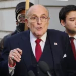 Former New York mayor Rudy Giuliani speaks to the press after a jury awarded 2 former Atlanta poll workers $148 million for defamation. WASHINGTON^ DC - December 15^ 2023