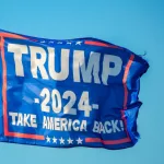 Trump 2024 flag flies at a pier on Coden Beach in Coden^ Alabama. Flag includes the slogan^ “Take America Back.”