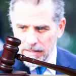 Hunter Biden ^court session. Judicial Hammer on the background of the photo.