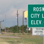 Highway sign for Roswell^ New Mexico