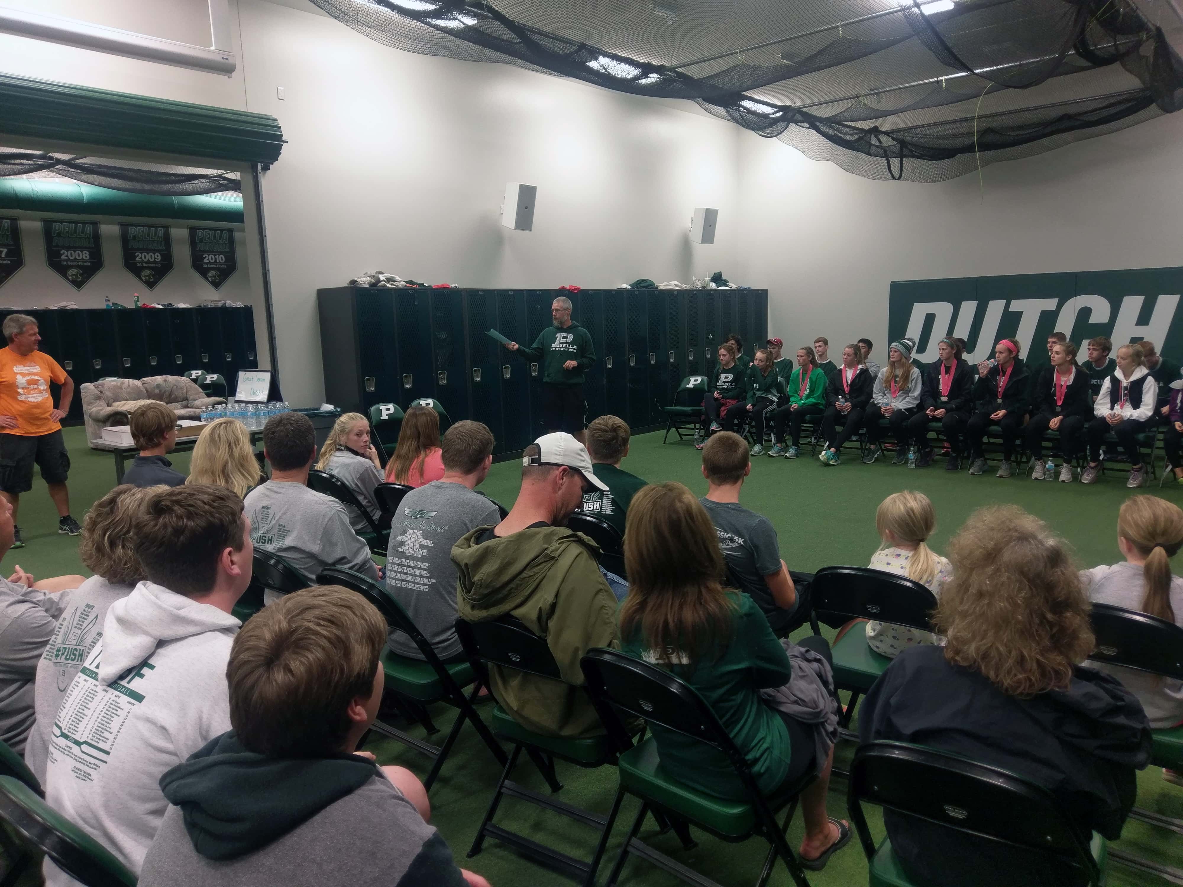 Pella's teams were welcomed home late Saturday by Booster Club 