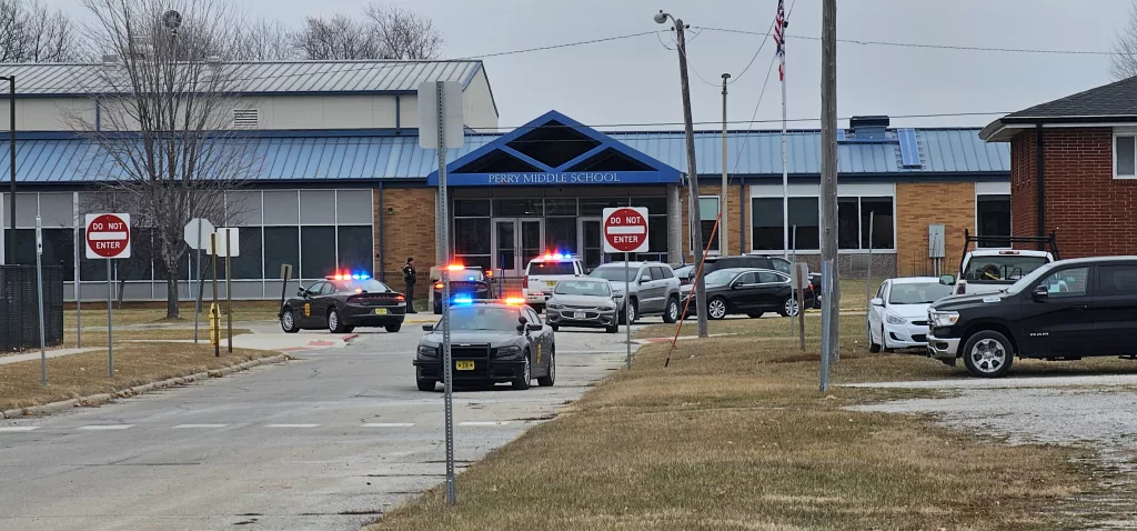 Perry Administrator Shot by Student has Pella, Central Connections - Vimarsana News