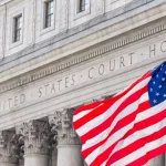 USA national flag waving in the wind in front of United States Court House in New York