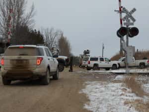 Up crews working at a railroad crossing on Kirkwood Road, about 1 mile east of County Road P-14