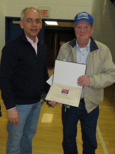 Activities director Tom Lipovac presents Bill Ridihalgh with his award (photo courtesy of Lynn Ubben)