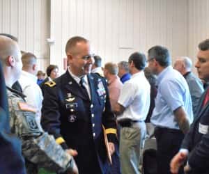 Major General Tim Orr being greeted