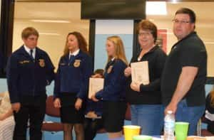 Susan and Chan Burkett pictured on the right receiving the Honorary FFA Degrees 