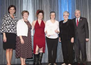 Tower View Team members (from left) Deb McGinn, Amy Roberts, Deb Kucerak and Lynda Cochran accept the Promotion--Image Award for Play Me Pleez.
