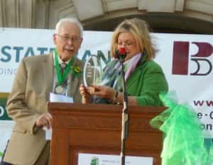 Tower of Fame committee member Carole Custer (right) presents awards to Dr. Hanson