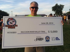 Raccoon River Valley Trail Association and Dallas County Conservation Board member Jim Miller accepts check from the BACooN Ride (Photo credit: Raccoon River Valley Trail Association)