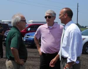 Rick Morain (left) talks with Tom Timmons (middle) and Rep. Chip Baltimore (right)