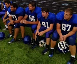 The Perry offensive and defensive line relax Friday night.