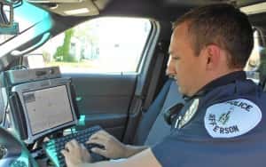 Officer Heath Enns using the new Toughbook computer