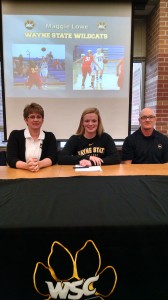 Maggie Lowe with parents Tom and Biddy, committed to Wayne State yesterday