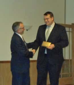 Greene County Medical Center CEO Carl Behne (right) receives plaque for 35 year membership