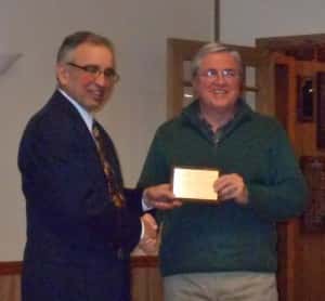 Bill Monroe (right) receives plaque for Medicap Pharmacy's 35 years as a Chamber member