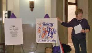 Peg Raney (right) unveils Relay for Life design.  T-shirt sponsors (left) and main design (middle)