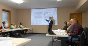 Duane Jensen (middle) explaining floor plans to the Planning & Zoning Commission