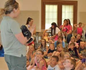 Kids learning about skunks