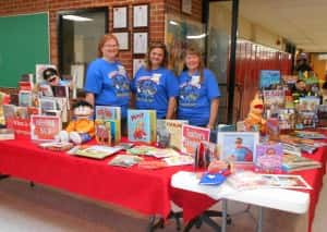 Jefferson Library staff at high school with a display