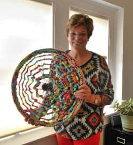 Peg Raney with decorated bike rim