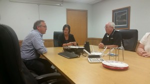 Congressman David Young (left) in Agri Drain's conference room. 