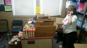 Chair Vi Jones works to organize the vast amounts of food donated to the pantry this holiday season. 