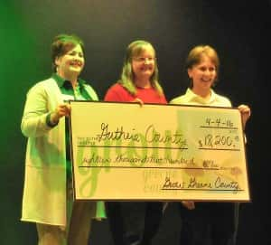 GGCGC Board Member Lori Mannel (left) presents funds to Guthrie County Community Foundation Secretary Julie Kipp (center) and President Laura Imerman (right).