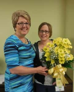 Public Health Director Becky Wolf (left) congratulating nurse Sarah Borgeson (right) for DAISY Award 