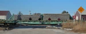 Permanent barricades at railroad crossing at Pinet Street